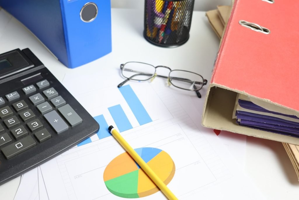 Financial planning desk with calculator and documents